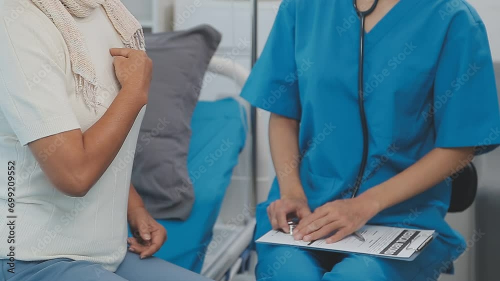 Close up of Female Doctor using stethoscope putting beat heart diagnose with patient in examination room at a hospital, check-up body, Medical and Health Care Concept.