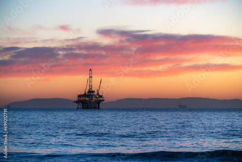 oil rig at sunset beach