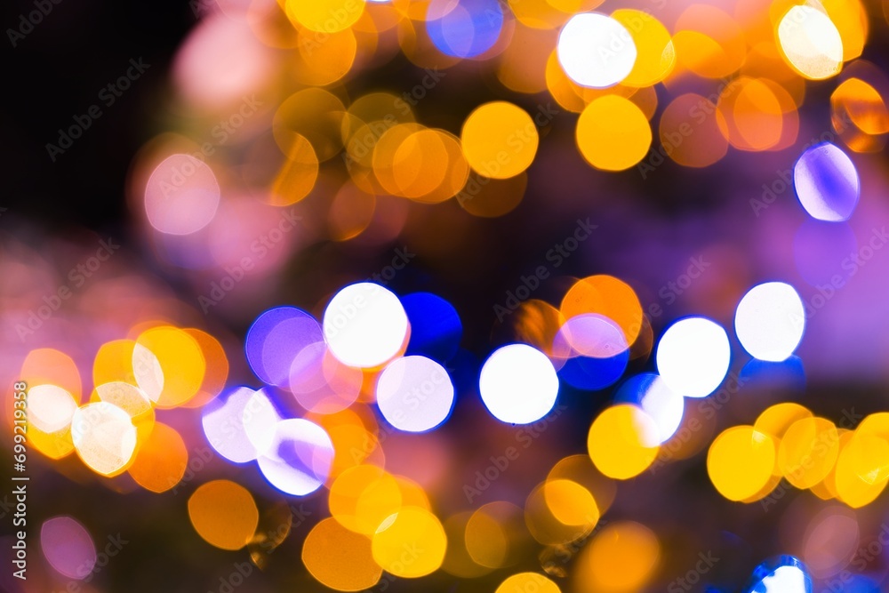A mesmerizing image captures the enchanting glow of blurred lights on a Christmas tree, creating a warm and festive ambiance. A mesmerizing image captures the enchanting glow of blurred lights on a Christmas tree, creating a warm and festive ambiance.