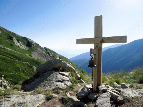 A wooden cross on a mountain path in the Pirin Mountains