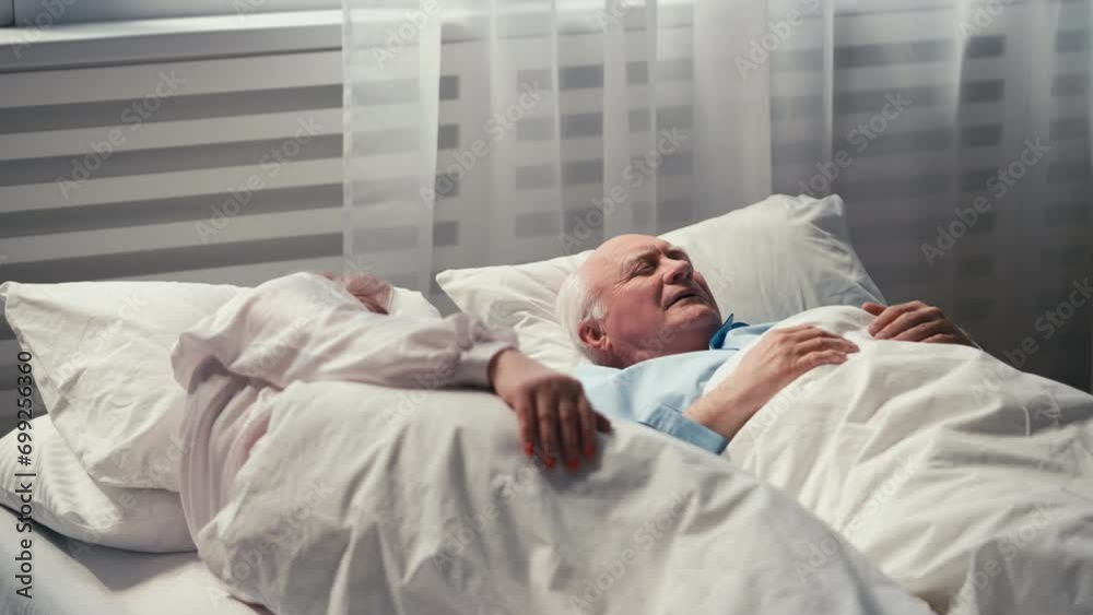 Senior couple having rest in bed and talking, close relationship, emotional bond Senior couple having rest in bed and talking, close relationship, emotional bond