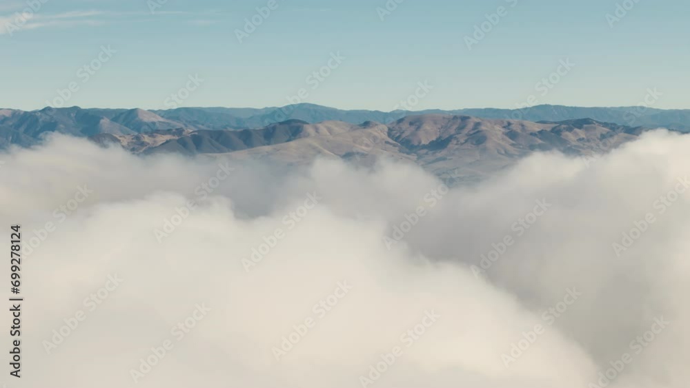 Wide Drone shot of flies through fluffy clouds in morning at orange sun summer. Wide Drone shot of flies through fluffy clouds in morning at orange sun summer.