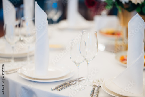 table with sign for number or names of guests in banquet hall of restaurant. 