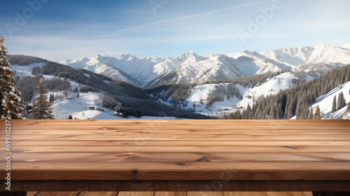 Empty brown wooden countertop, with a beautiful view of the snowy mountains and blue sky