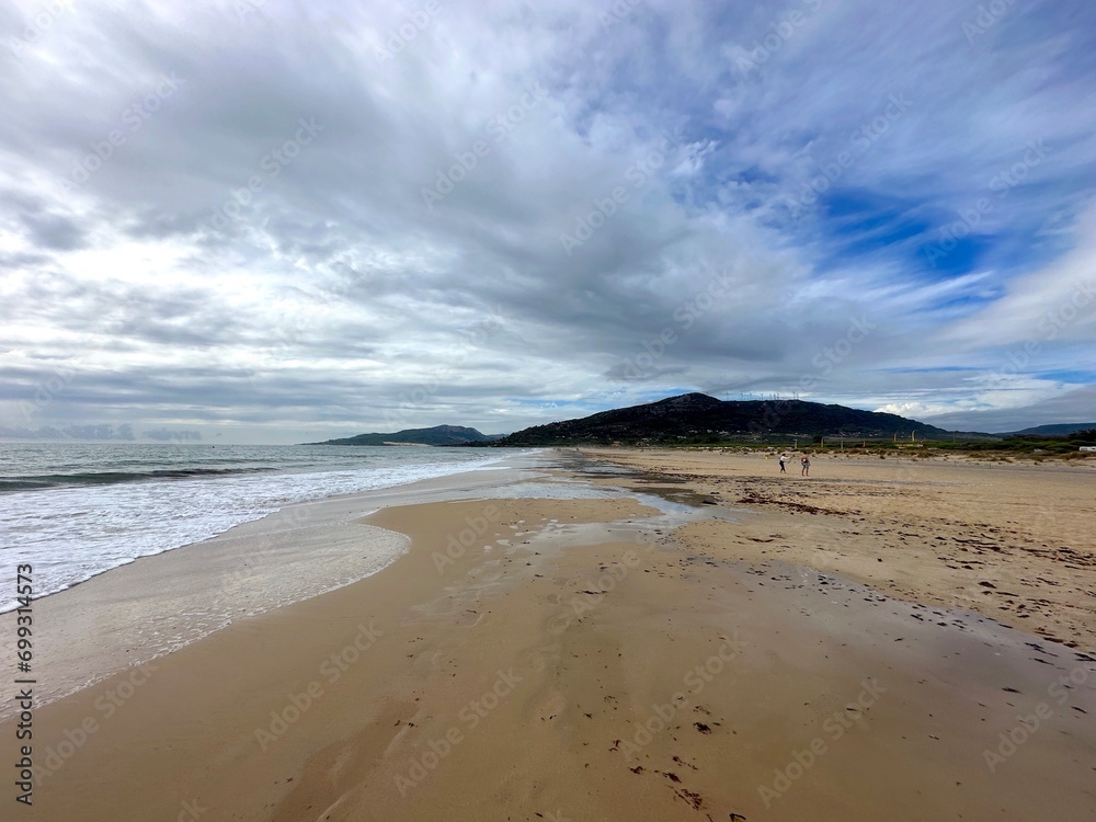 beach near Tarifa with a view towards the dune of Valdevaqueros at a stormy day, Playa de los Lances, Playa Santa Catalina, Andalusia, province of Cádiz, Spain beach near Tarifa with a view towards the dune of Valdevaqueros at a stormy day, Playa de los Lances, Playa Santa Catalina, Andalusia, province of Cádiz, Spain