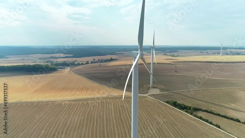 Circling Around Wind Turbine in Dried Out Fields, Long Shot - Haute Marne, France 4K Drone Footage
 photo