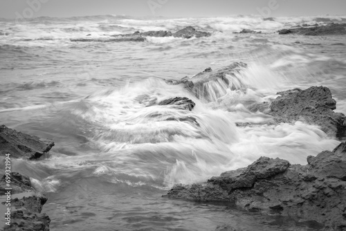 waves crashing on rocks