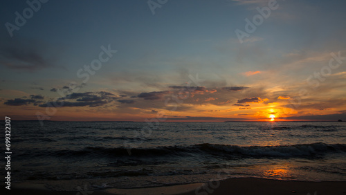 Fototapeta Naklejka Na Ścianę i Meble -  Orange sunset on the sea, dramatic sunset