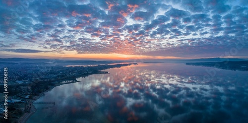 Lake Constance reflected in the morning sky, on the left the town of Radolfzell, on the horizon the Mettnau peninsula and the island of Reichenau, on the right the Hoeri peninsula, Radolfzell photo