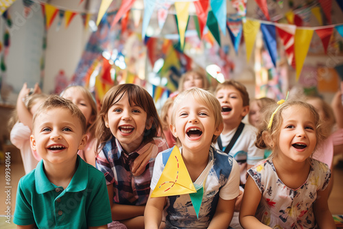 Happy Kids in primary school against festival flags garland