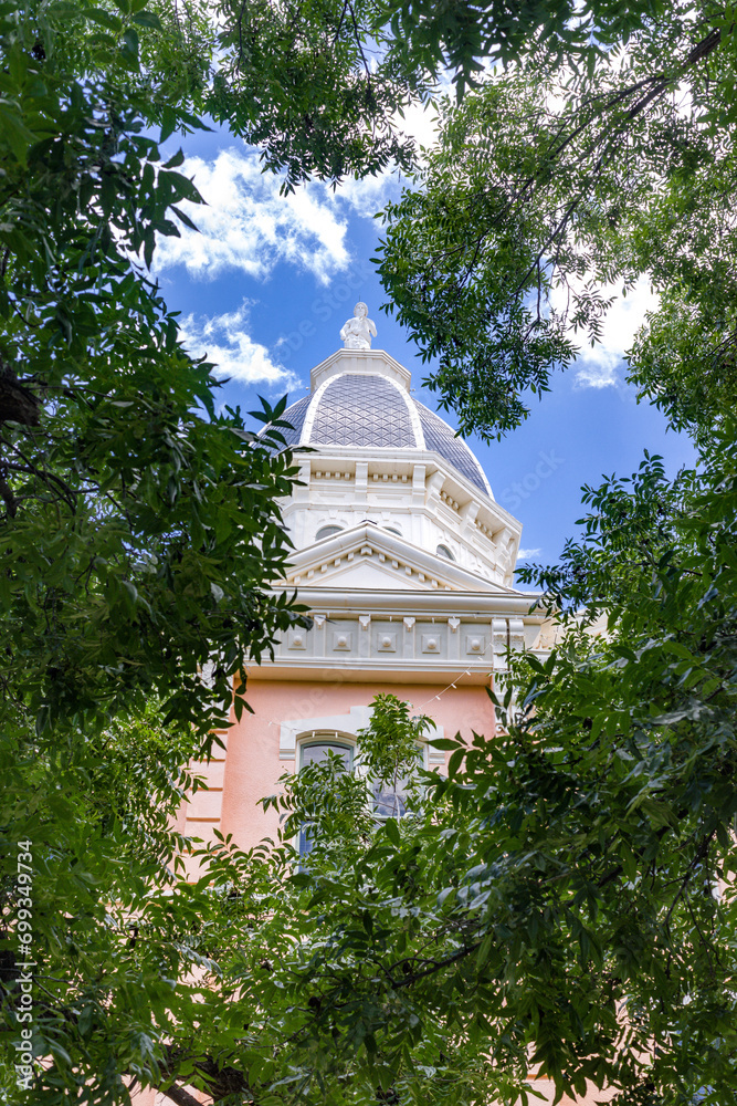 Vertical: The pink colored Empire Style architecture Presidio County Courthouse in Marfa, Texas has been added the National Registry of Historic Places.