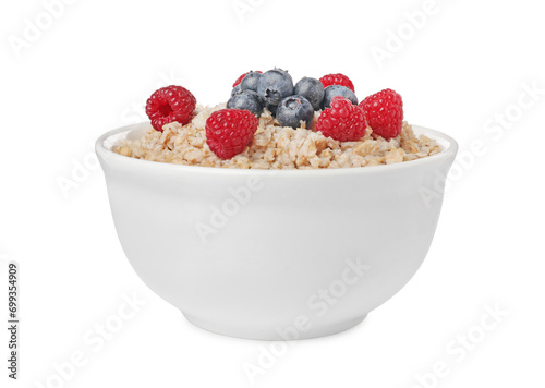 Tasty boiled oatmeal with berries in bowl isolated on white