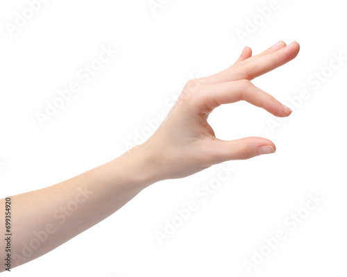 Woman holding something in fingers on white background, closeup