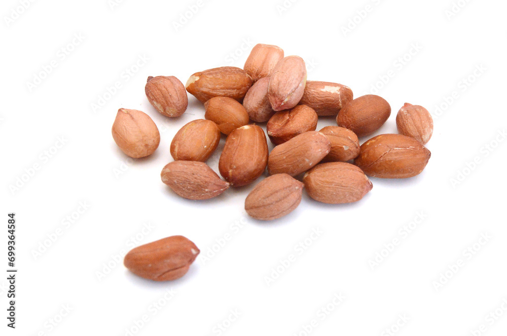 Dried peanuts in closeup on white Dried peanuts in closeup on white