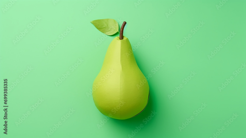 top view of handmade paper pear isolated on green top view of handmade paper pear isolated on green