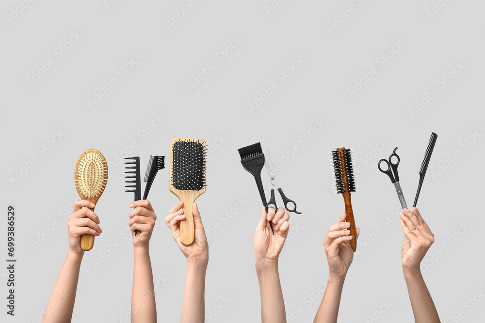 Many female hands with hair supplies on white background. - obrazy, fototapety, plakaty 