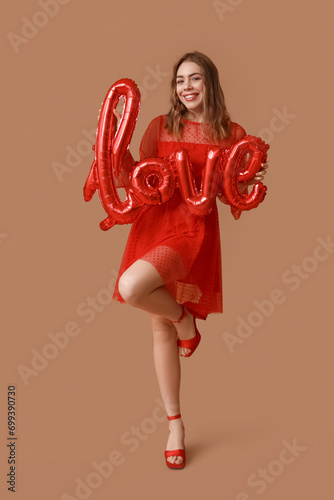 Smiling young woman in red ...