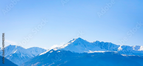 The banner mountain view of alpine as snow-capped mount peaks scene  in Winter mountains background © SASITHORN