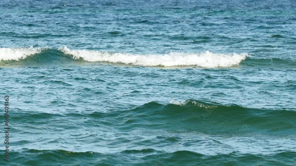 Waves Rolling In The Blue Ocean In Hel Peninsula, Kuznica, Poland. - slow motion Waves Rolling In The Blue Ocean In Hel Peninsula, Kuznica, Poland. - slow motion