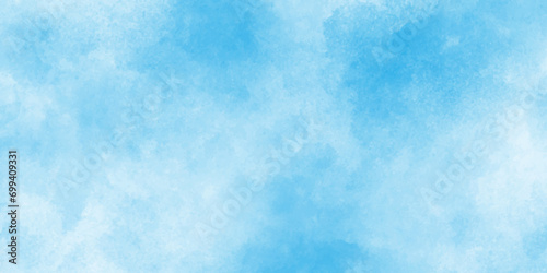 Beautiful and shinny cloudy blue watercolor background, sky blue shades light green paper texture, blurred and grainy Blue powder explosion on white background, Classic brush painted Blue sky. 