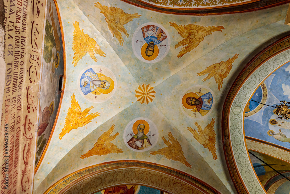 The ceiling is painted on a religious theme in the main hall of the Greek Orthodox Church of the Annunciation in Nazareth old city in northern Israel