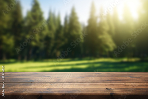 Wooden table on blurred nature background. Empty table for display your product