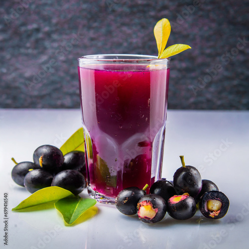 Juice of jamun fruit in a glass also called as java plum, jambolan plum, jambhul, syzygium cumini photo