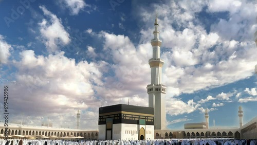 Close up of Haram Mosque minaret in a cloudy day, holy Kaaba Animation With Heaven Atmosphere Effect. Kaaba in Masjid Al Haram in Mecca Saudi Arabi. Generative AI photo