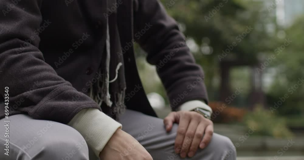 Vidéo Stock A sad, depressed and worried man sitting on a bench in a