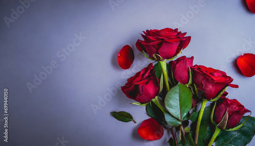  close up beautiful red roses and love petals, with space for text, on a plain gradient background