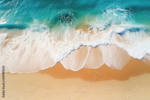Aerial view of sandy tropical beach in summer. Aerial landscape of sandy beach and ocean with waves viewed from a drone
