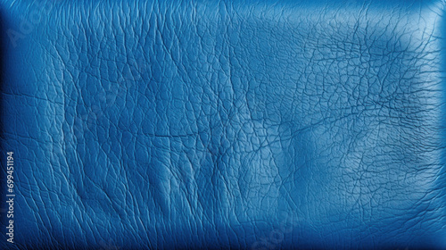 Close-up of blue leather material highlighting its textured surface and detail, suitable for backgrounds or design elements. photo