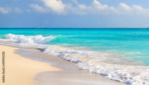 tropical beach scene: azure ocean, sunny sky, and sandy shore, evoking relaxation and serenity