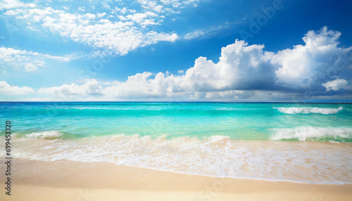 tropical beach scene: azure ocean, sunny sky, and sandy shore, evoking relaxation and serenity