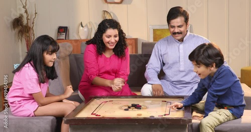 Wallpaper Mural Video of Happy family playing carrom together at home
 Torontodigital.ca