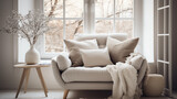 Cozy armchair near the window with many pillows standing in living room interior 
