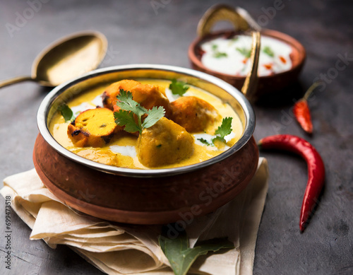 punjabi kadhi pakoda or curry pakora, indian cuisine served in a bowl or karahi, selective focus