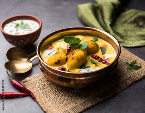 punjabi kadhi pakoda or curry pakora, indian cuisine served in a bowl or karahi, selective focus photo