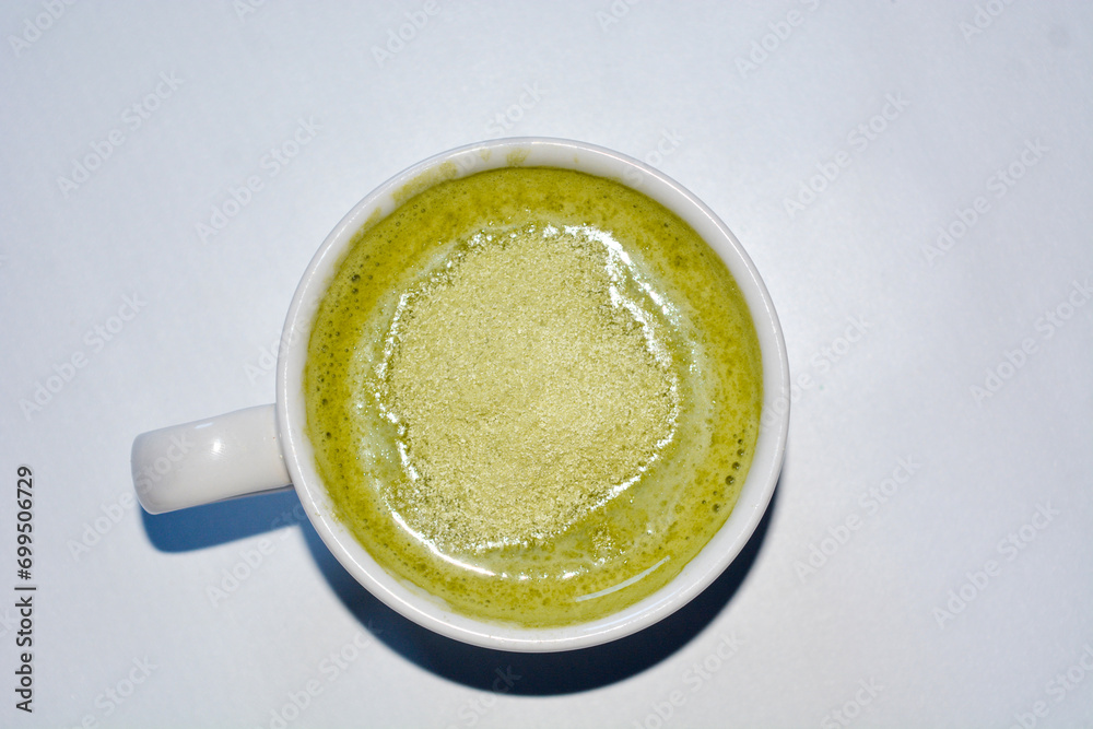Close up of a glass of milky matcha drink Close up of a glass of milky matcha drink