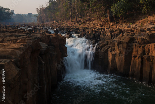 Closeup flowing waterfall from the rocks. Bolaven Plateau  Laos