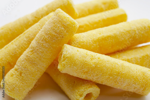 Roller corn snack on white background