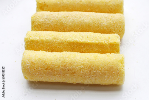 Roller corn snack on white background