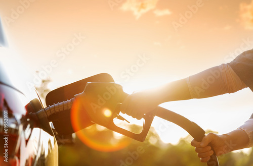 Woman hand refuel the car photo