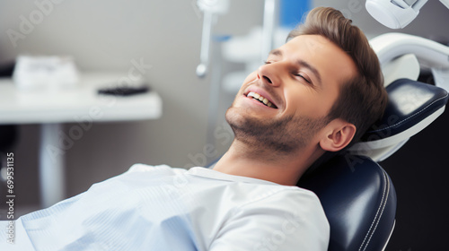 Handsome Man Receiving Dental Care in Clinic  Orthodontic Chair View