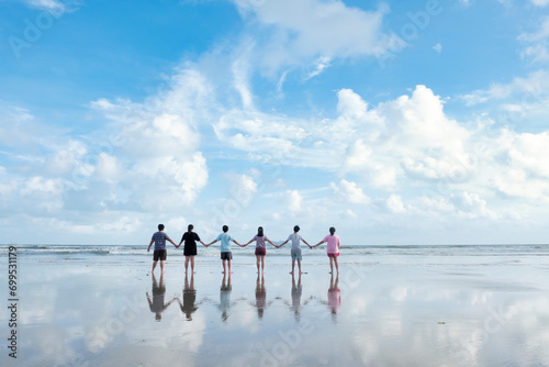 Family Members Enjoying A Beautiful Moment On The Beach