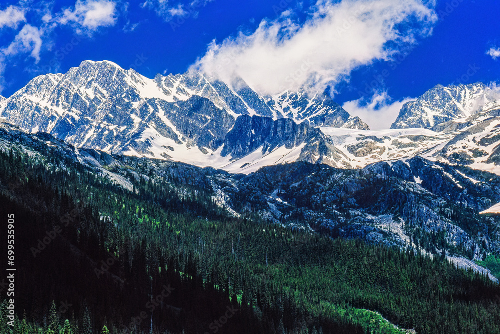 Scenic view at a mountainous landscape view with snow capped peaks