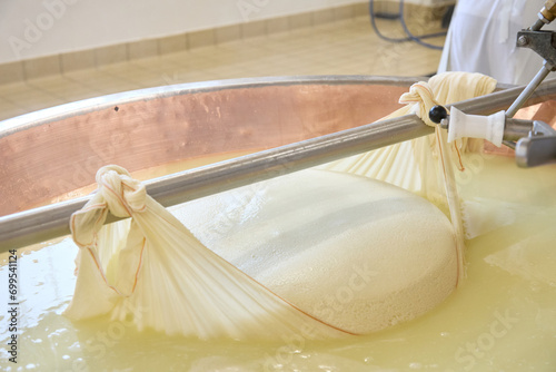 extraction phase of the Grana Padano curd in the boiler