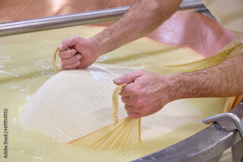 extraction phase of the Grana Padano curd in the boiler