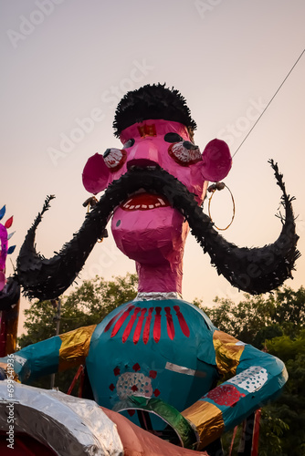 Ravnans being ignited during Dussera festival at ramleela ground in Delhi, India, Big statue of Ravana to get fire during the Fair of Dussera to celebrate the victory of truth by Lord Rama photo