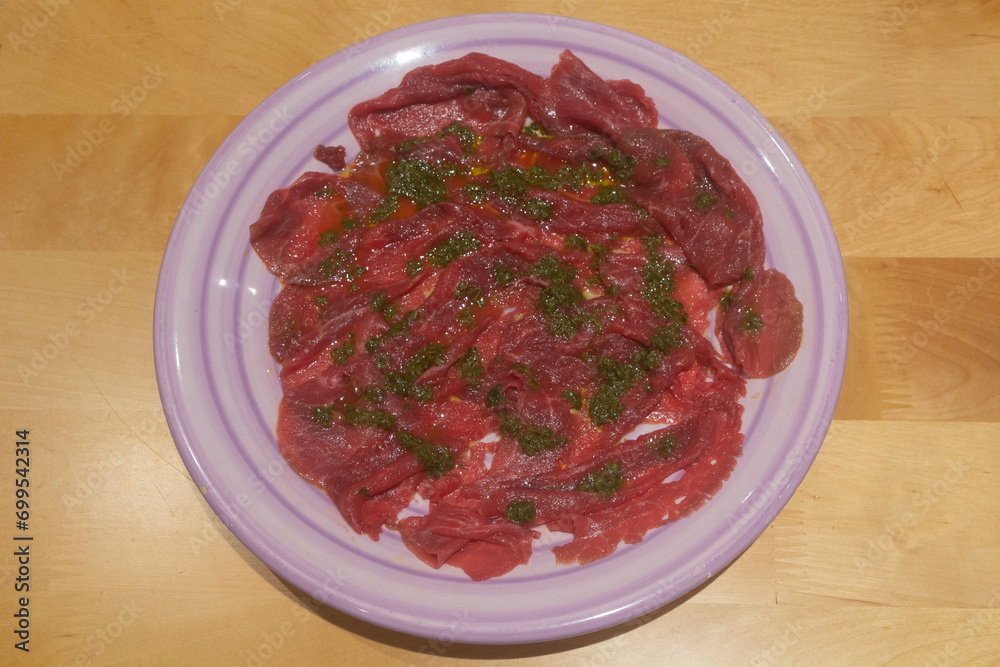 Carpaccio with oil and basil Carpaccio with oil and basil